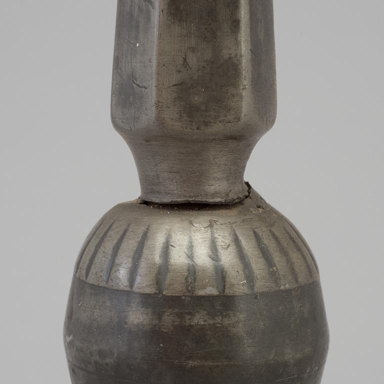 A 17th century pewter candlestick.