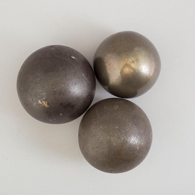 Three 19th century iron balls.