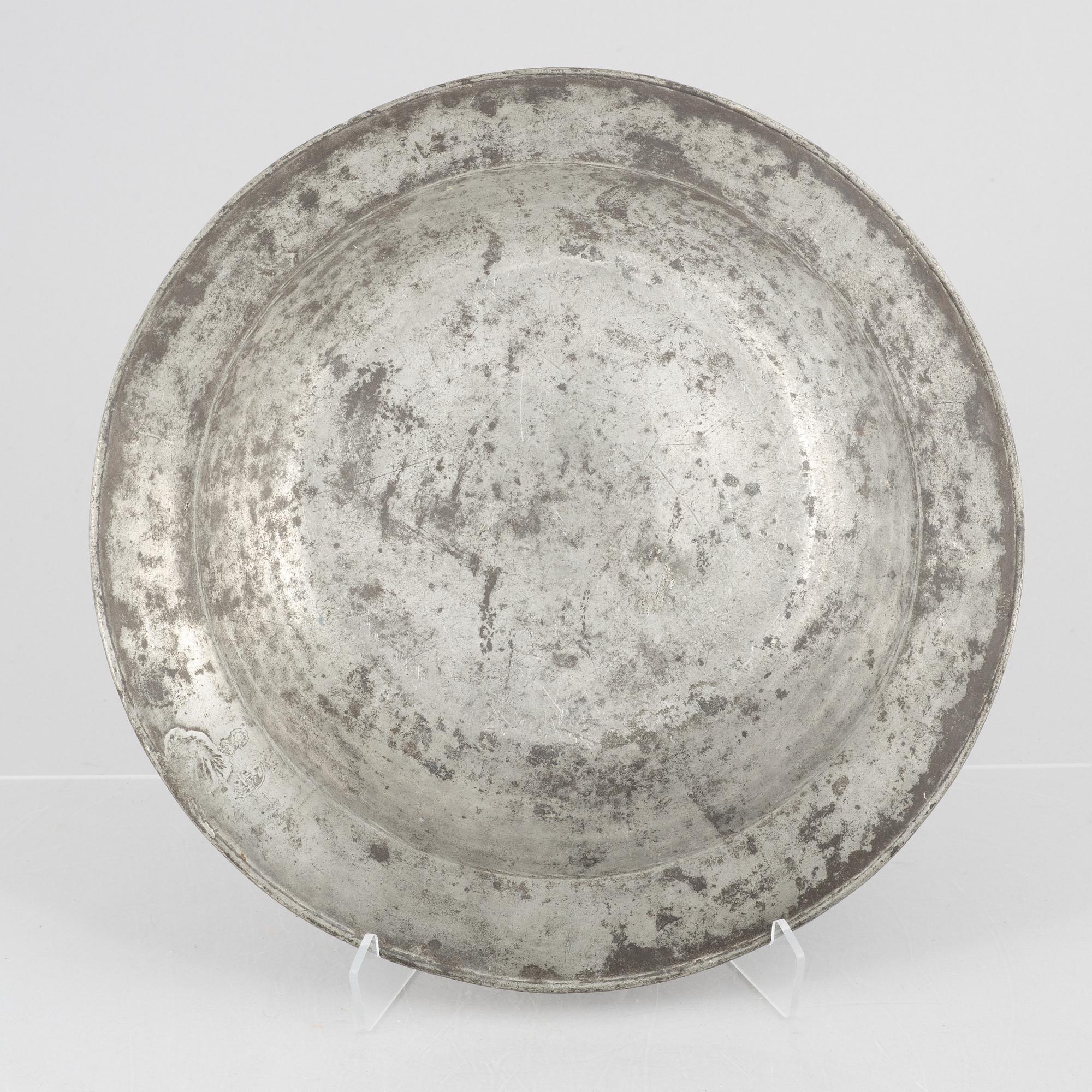A large pewter charger, Sweden, dated 1701.