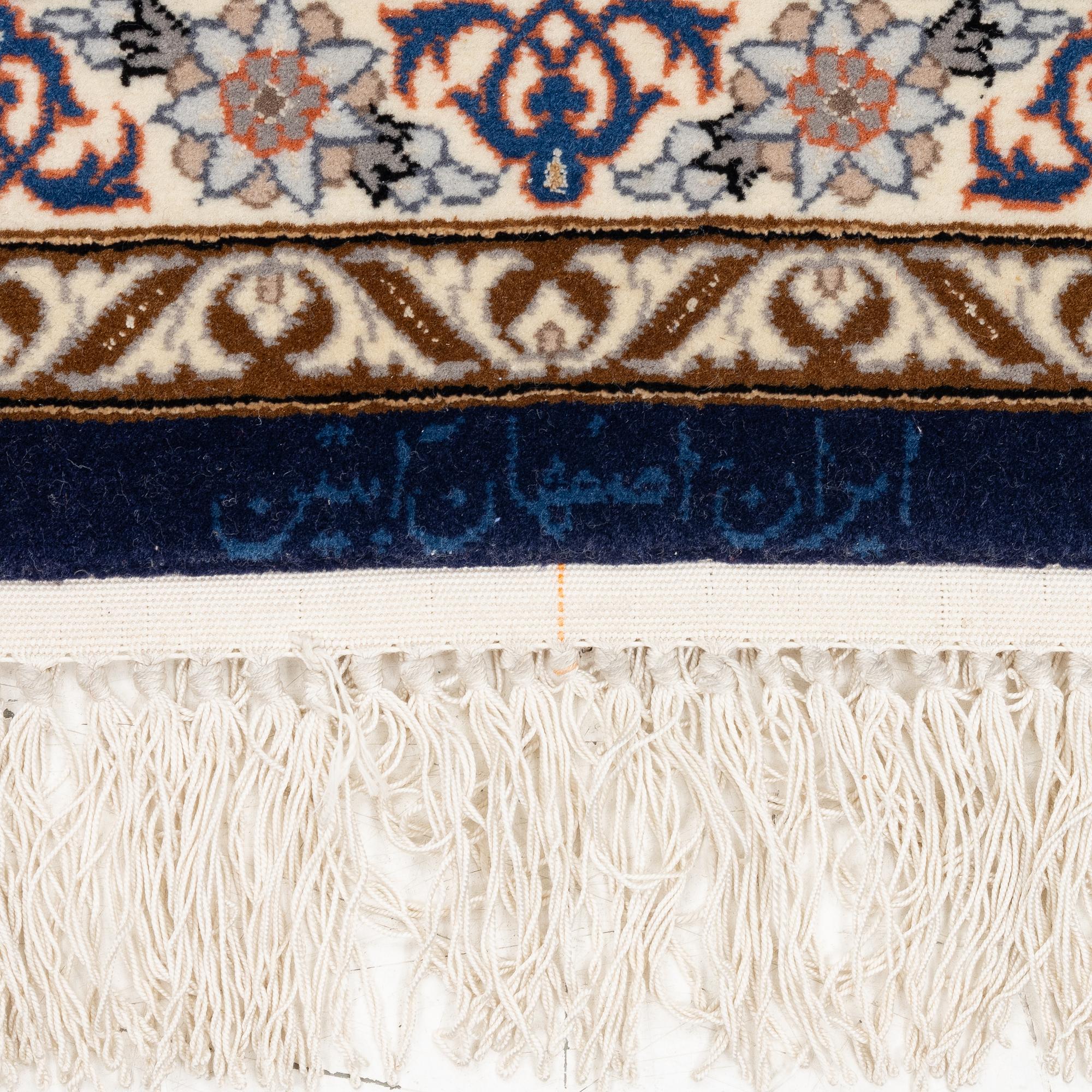 An Isfahan rug, c. 220 x 145 cm.