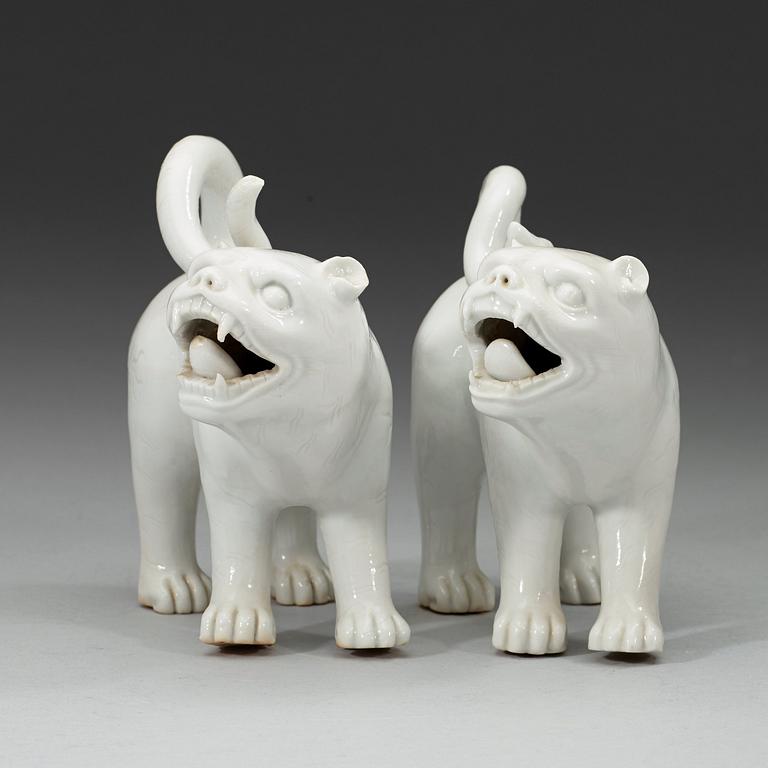 A set of two blanc de chine mythological animals, late Qing dynasty.