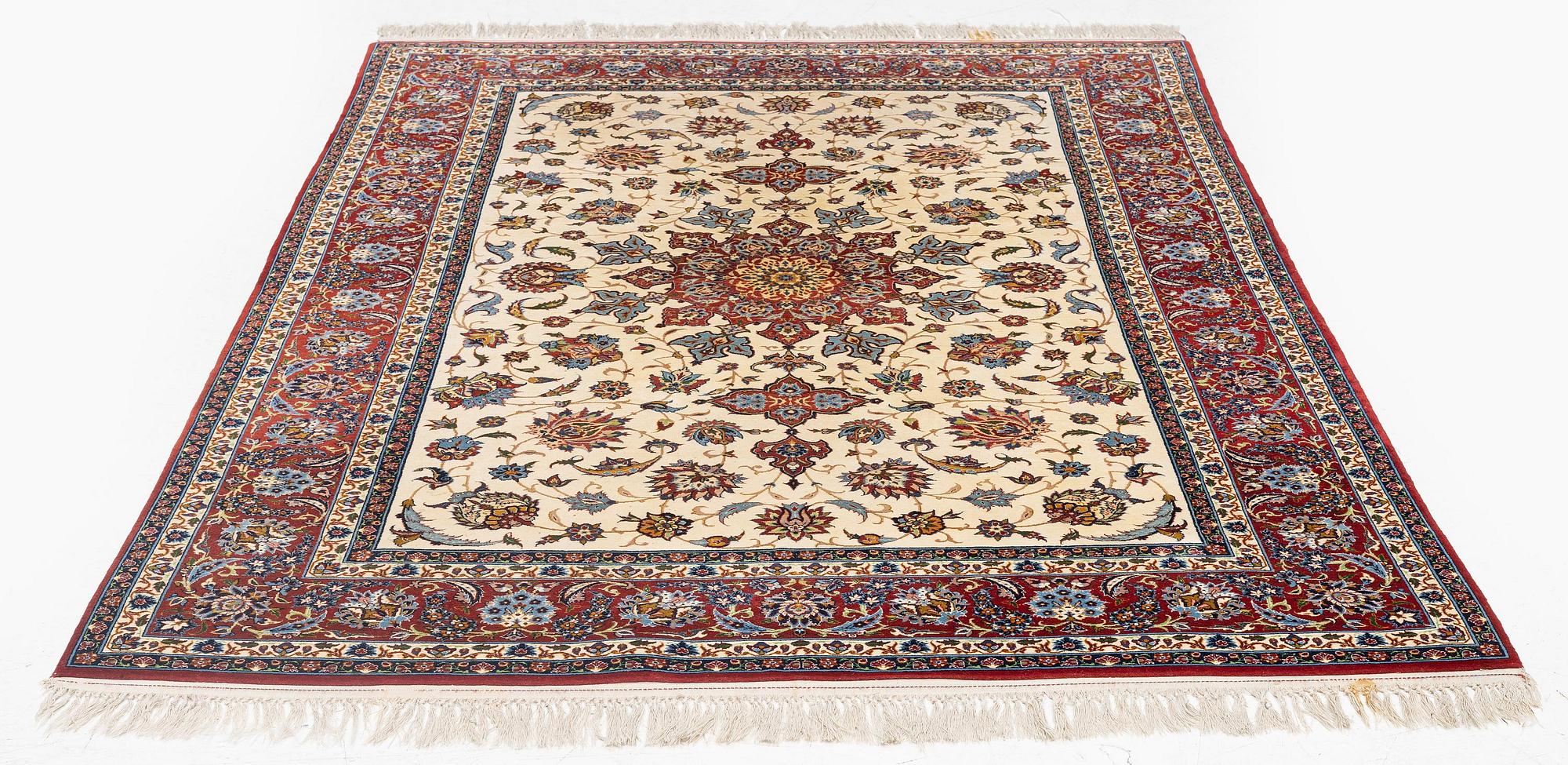 A semi-antique Isfahan rug, c. 225 x 143 cm.