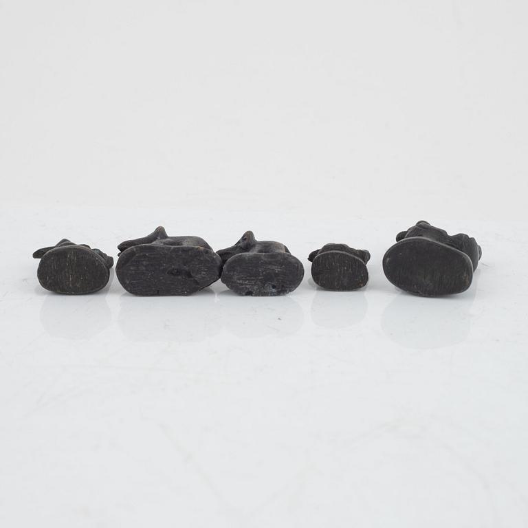 Nine bronze opium weights, Burma, 19th/20th century.