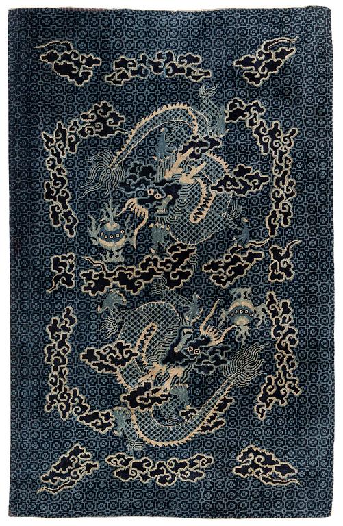 A Chinese 'dragon' rug, circa 1920. (c 190x122 cm).
