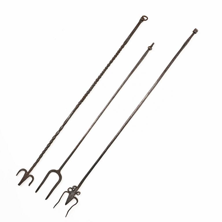 A set of three wrought iron fireplace pokers, 18th / 19th century.