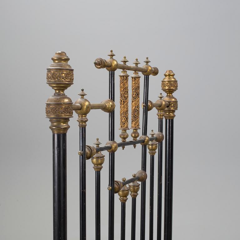 An iron bed, late 19th century.