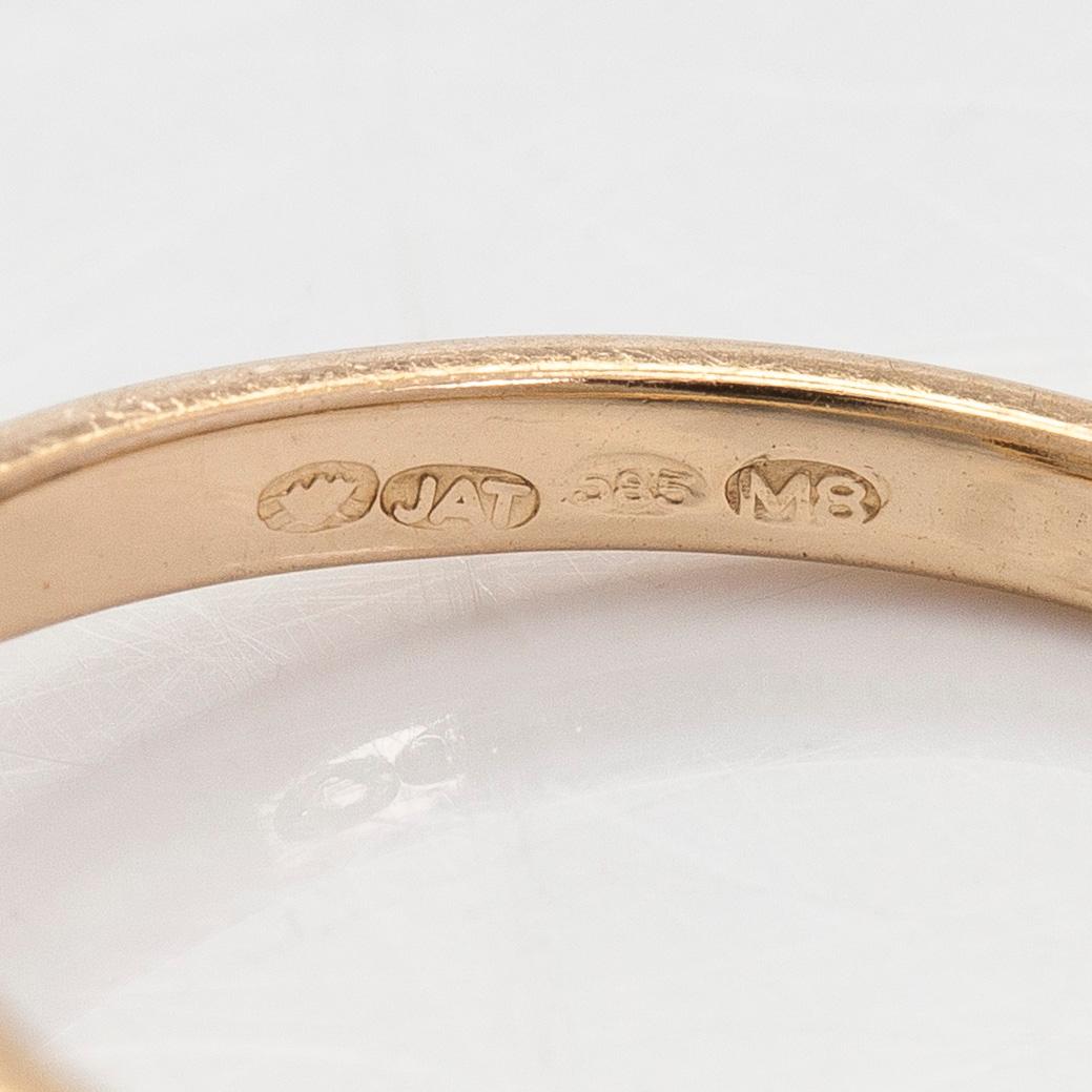 A 14K gold ring with old-cut diamonds.