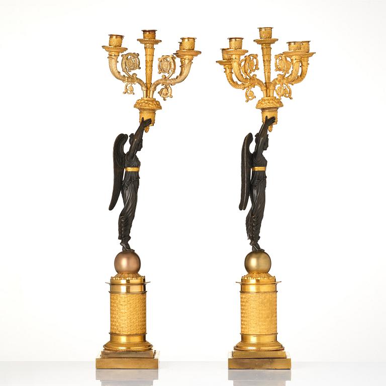 A pair of French Empire five-light candelabra, attributed to Francois Rabiat (bronze maker in Paris 1756-1815).