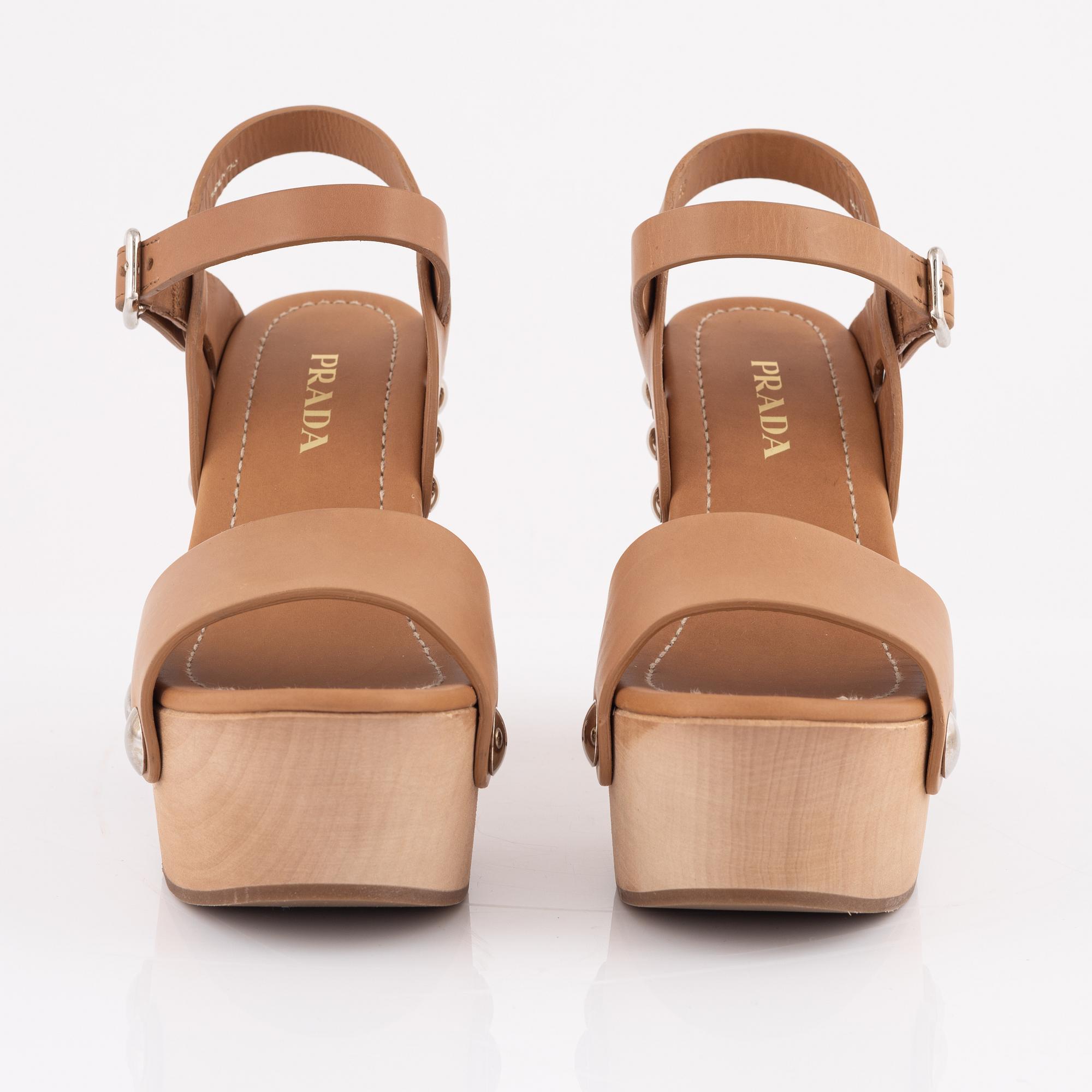 Prada, a pair of wood and leather sandals, size 37.