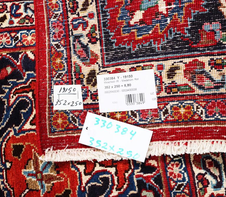 A Meshed carpet, c. 352 x 250 cm.