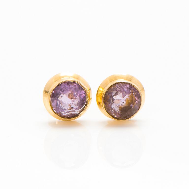 A set of 14K gold earrings and a ring with amethysts.