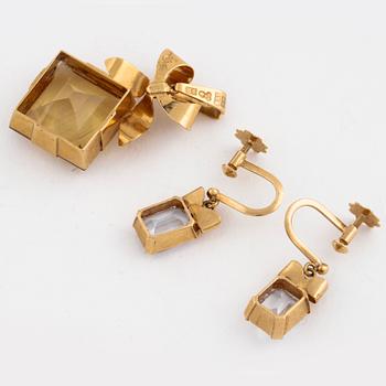 A citrine pendant and a pair of synthetic spinell earrings.