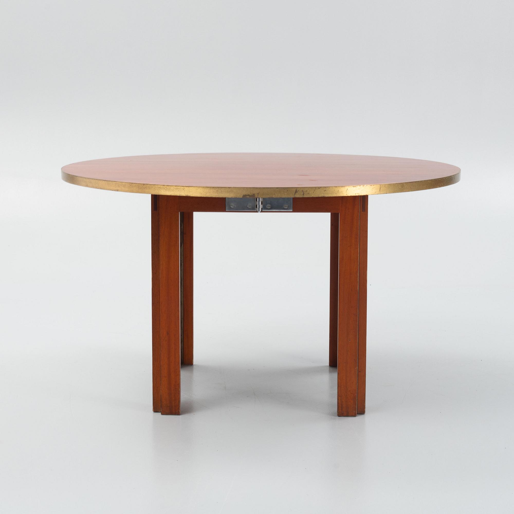 A mid 20th century dining table.