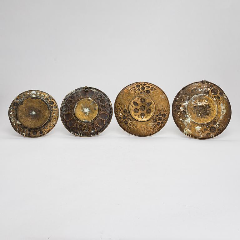 Four mid-17th century Northern and Central European reflectors plates.