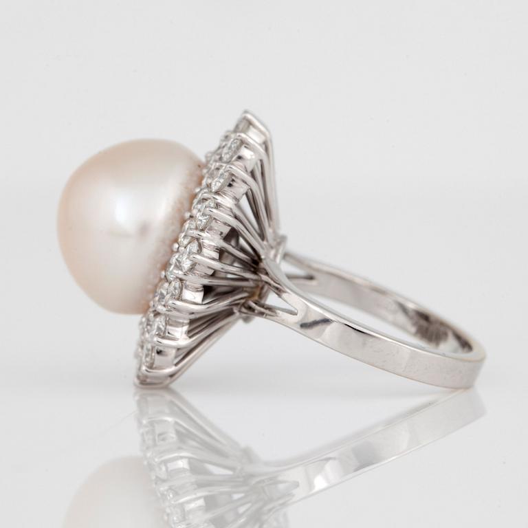 A cultured South Sea pearl and diamond ring.