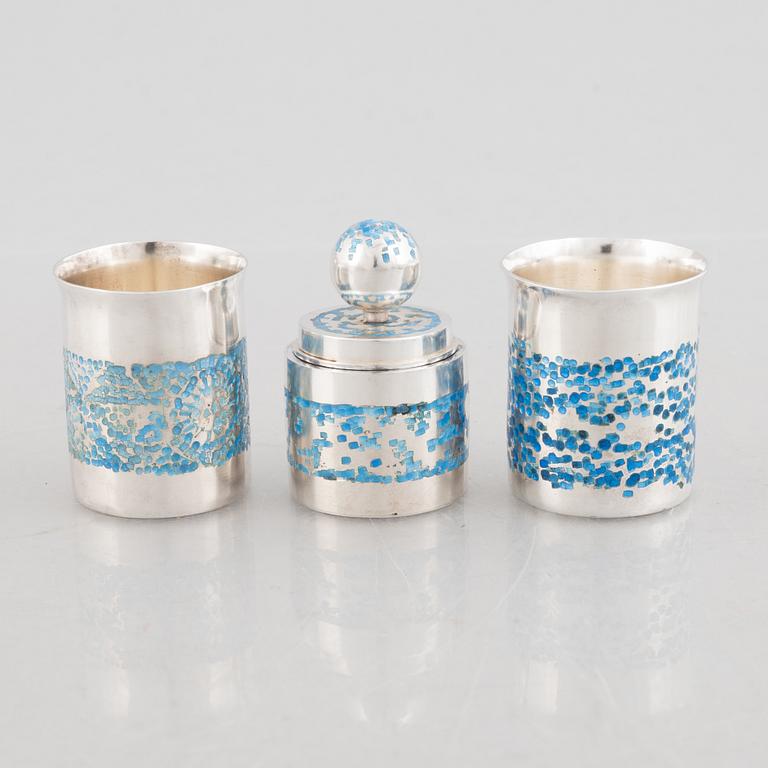 Two sterling silver and enamel miniature beakers and a small box with lid, marks of Lars Arby, Gothenburg, Sweden.