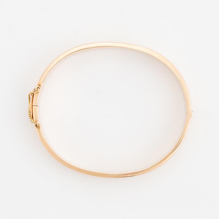 A 14K gold bracelet.