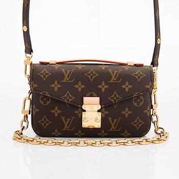 Louis Vuitton, a Monogram Canvas "Pochette Métis East West" bag.