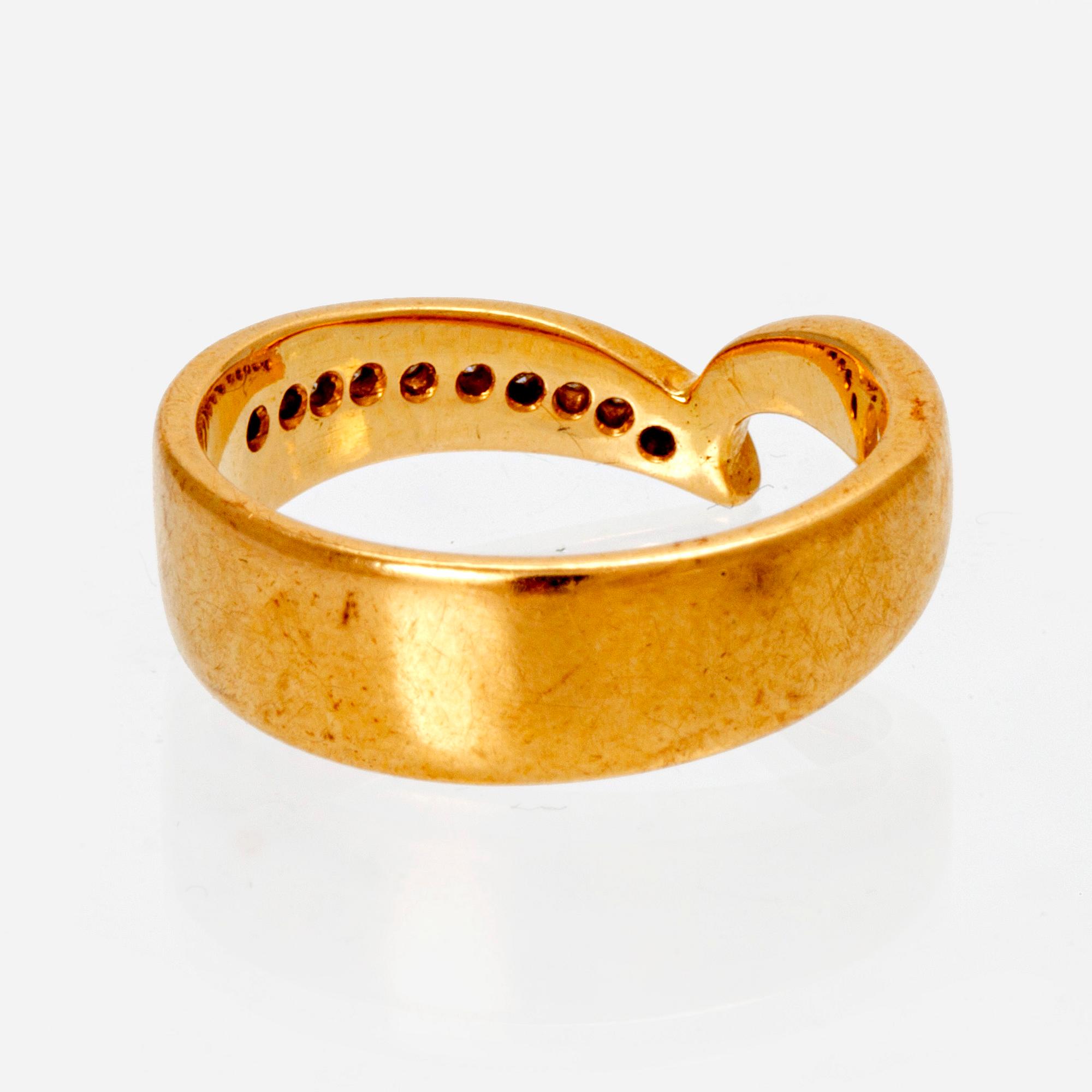 An 18K gold ring with octagonal cut diamonds.