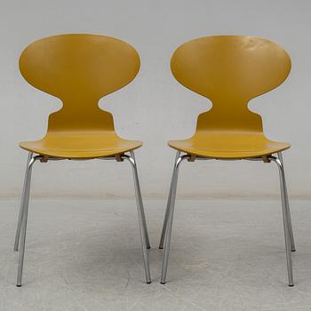 BRUNO MATHSSON & PIET HEIN, and ARNE JACOBSEN, a 'Supercirkel' table and two 'Myran' chairs, from Fritz Hansen.