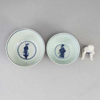 A set of two blue and white bowls and a figurine, Ming dynasty and Qing dynasty, 17th Century.
