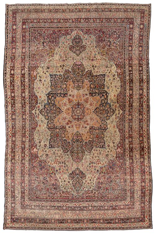 An antique Kerman Laver carpet, c. 586 x 385 cm.