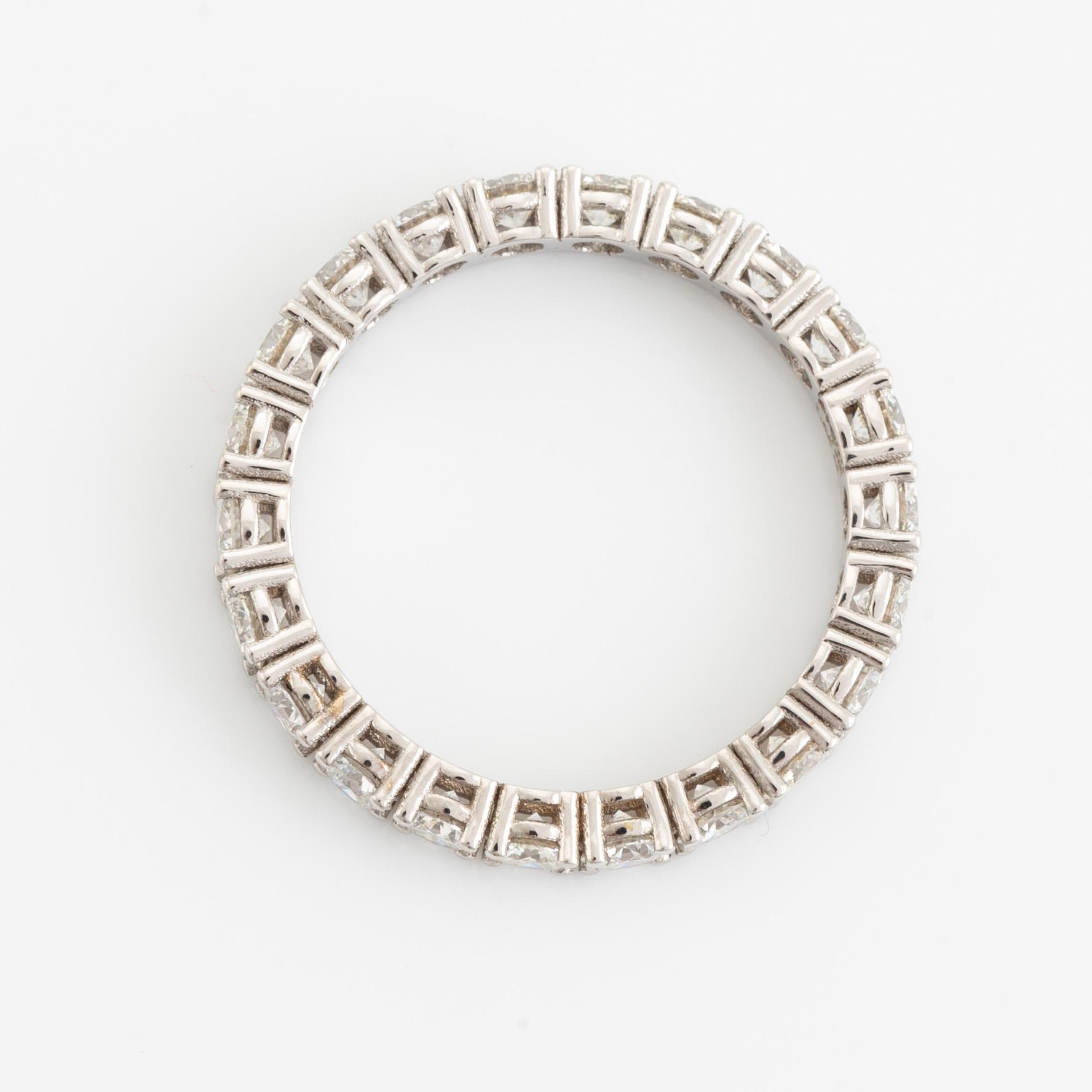 Brilliant cut diamond eternity ring.