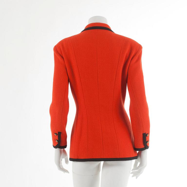 CHANEL, a orange wool jacket. French size 42.