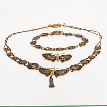 A silver-plated, gilded and lacquered metal parure from Japan, first half of the 20th century.