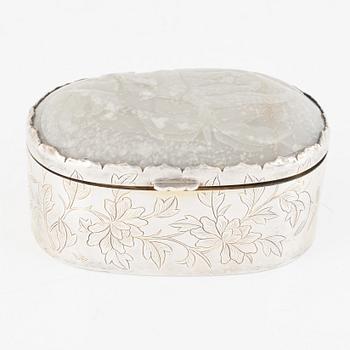 A silver box, the cover set with an inlaid Chinese nephrite relief, 20th century.