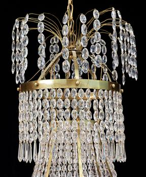 A Swedish Empire 19th century nine-light chandelier.