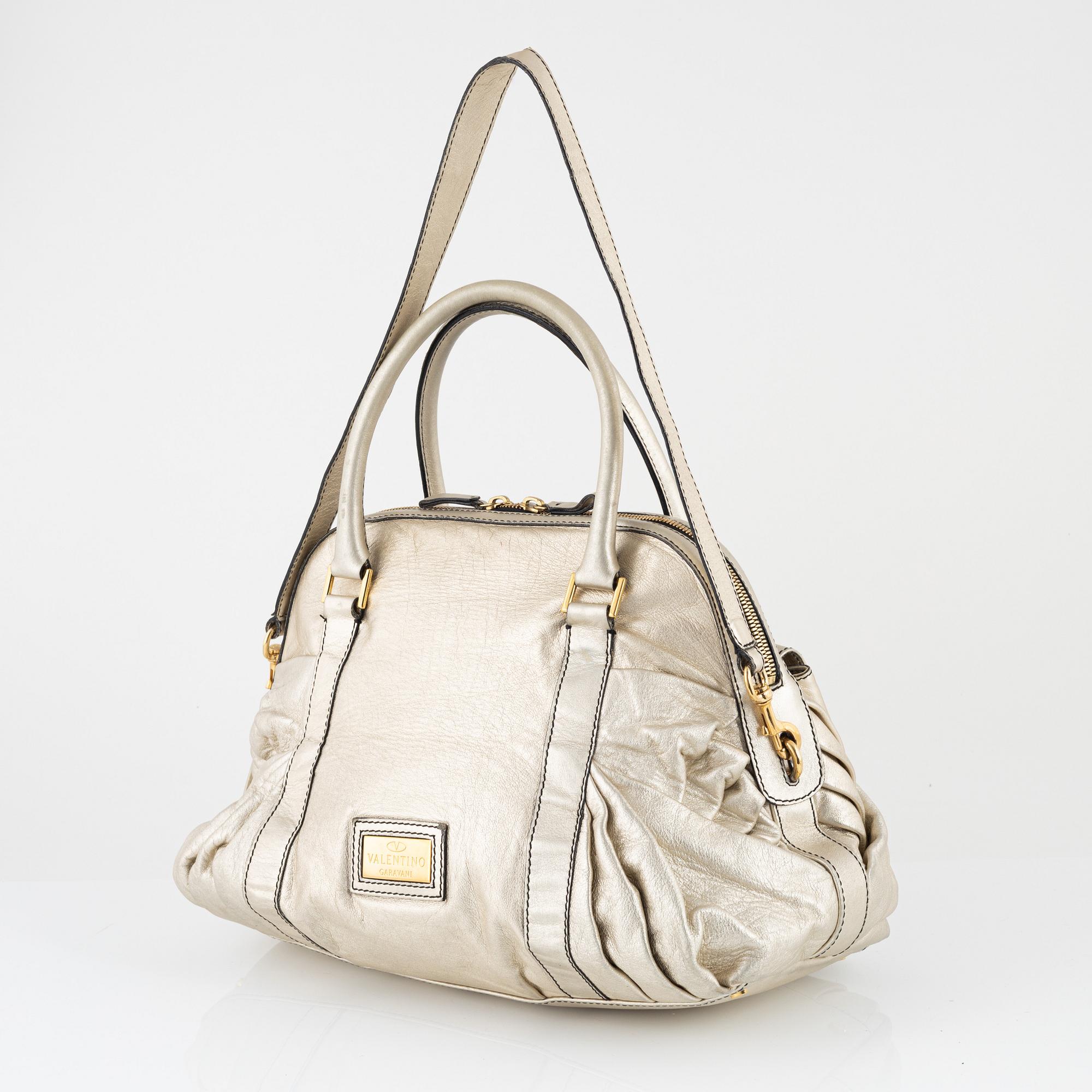 Valentino Garavani, A metallic leather bag.
