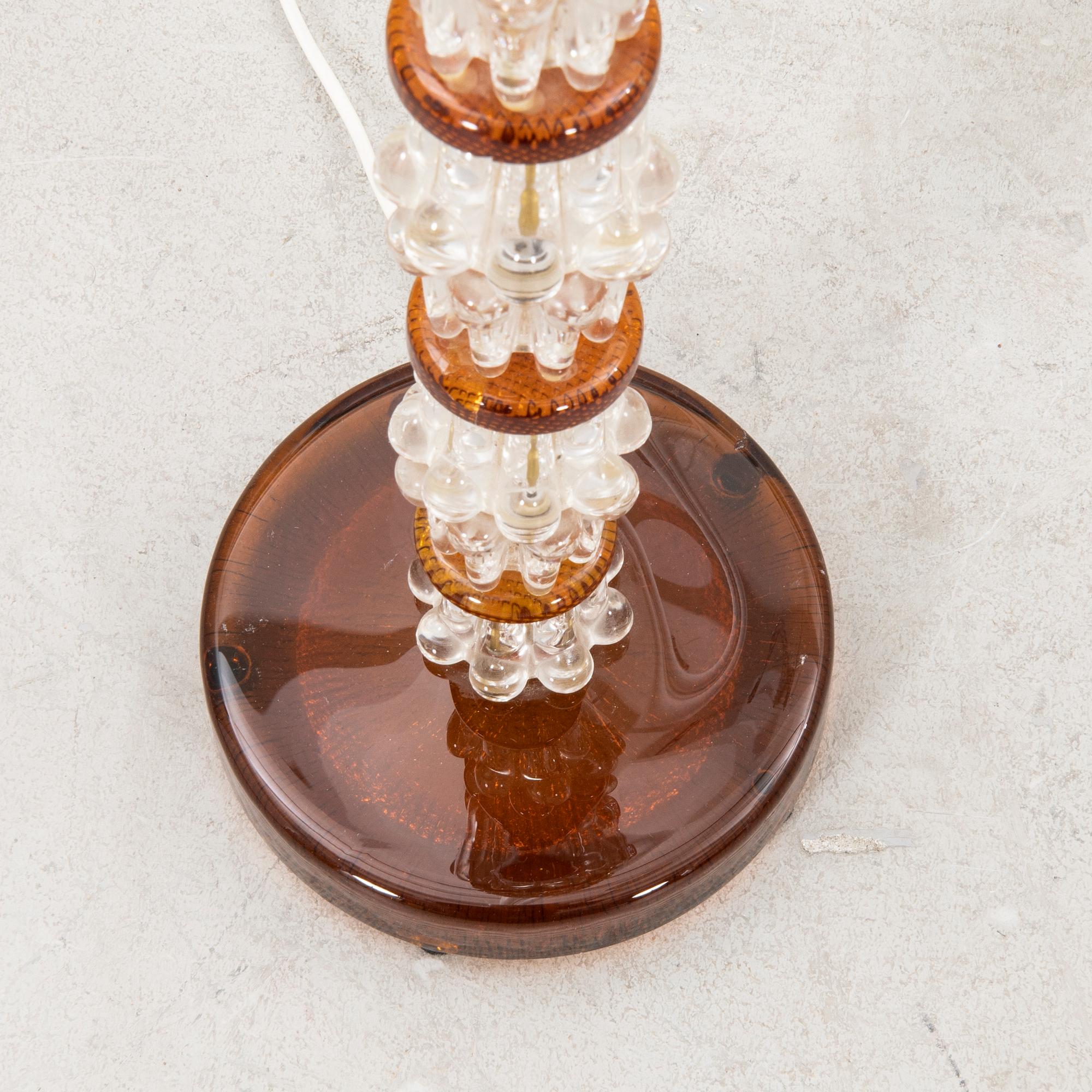 A 1970s glass floor lamp.
