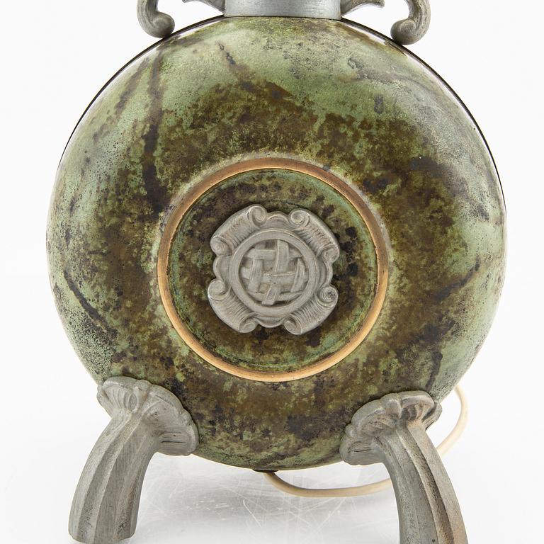 A 1940s metal table lamp.