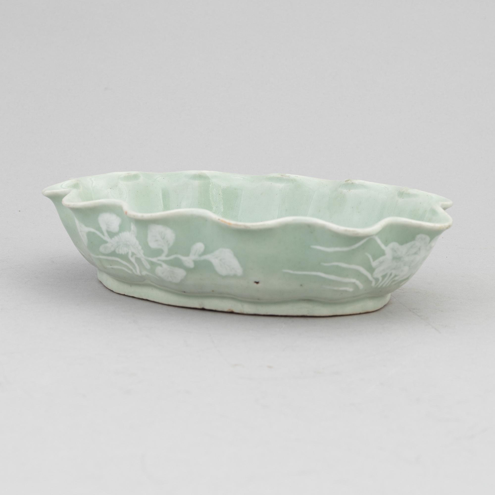 A Chinese celadon glazed lotus leaf shaped bowl, late Qing dynasty, and a ge-glazed brush washer, possibly 20 century.