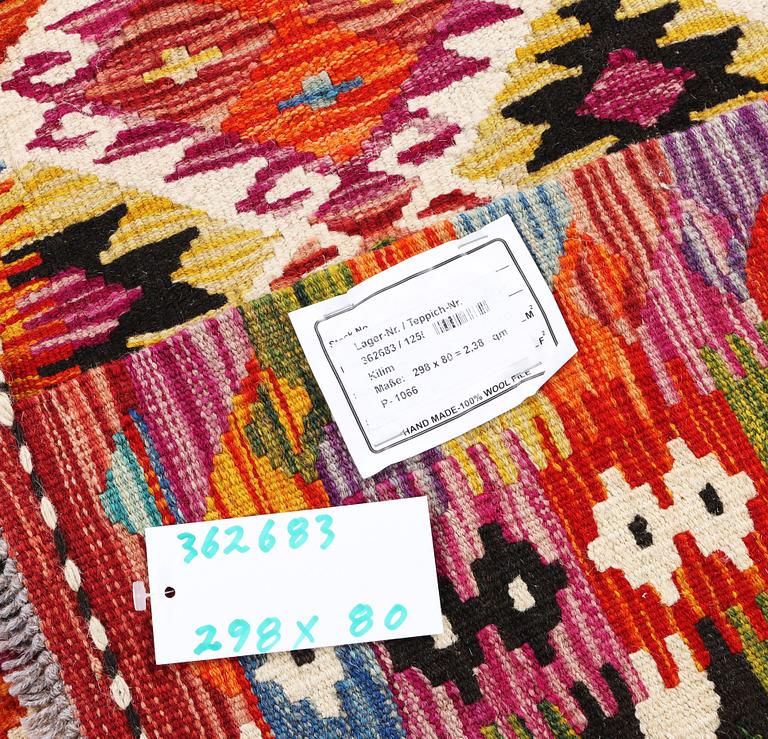 A Kilim runner carpet, c. 298 x 80 cm.