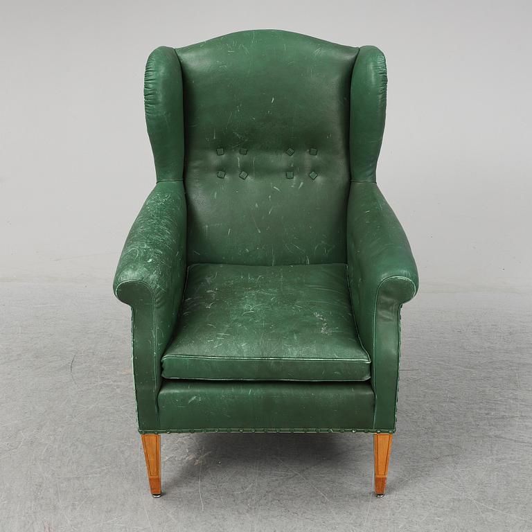 A leather wing-chair.