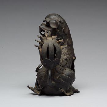 A bronze censer with cover in the shape of a Buddhist lion, Qing dynasty, 19th Century.