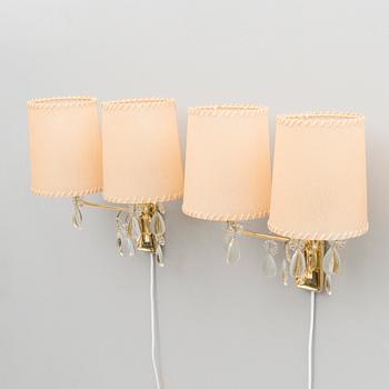 A pair of early 1950s '9413' wall lights for Taito, Finland.