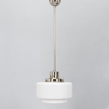 Paavo Tynell, kattovalaisin, malli 2004, Taito 1930-luku.