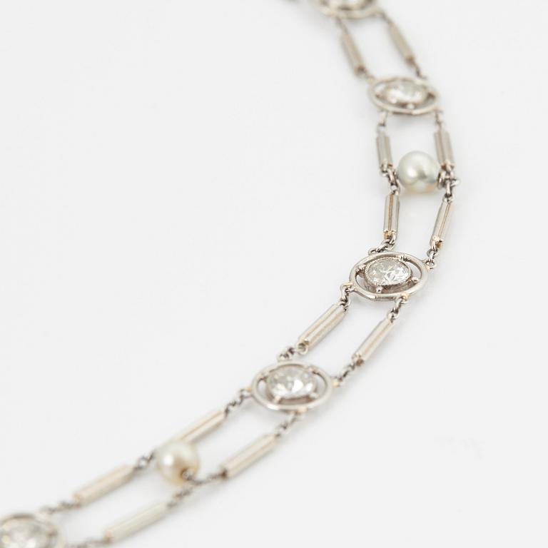 A NECKLACE with round brilliant-cut diamonds and pearls.
