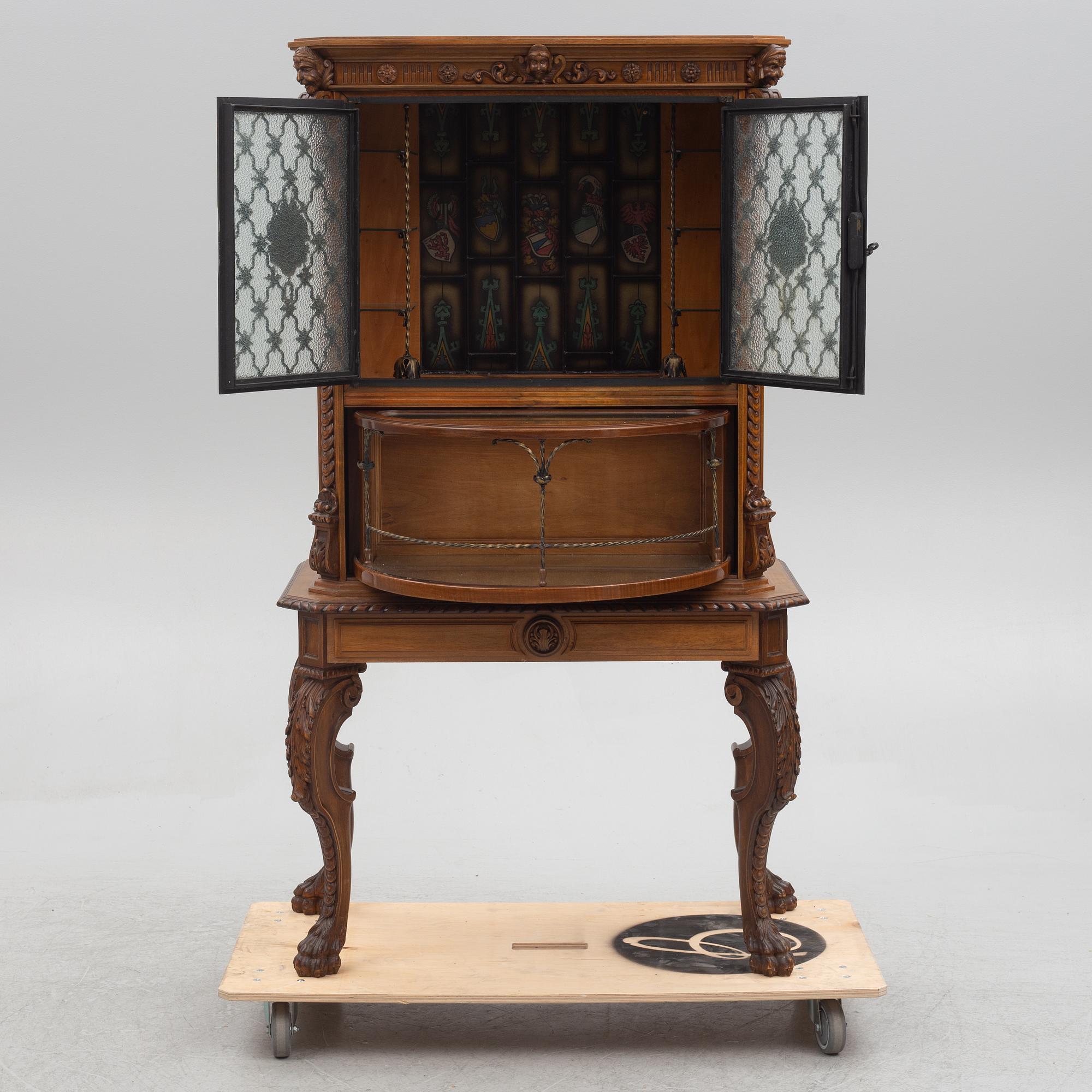 A Baroque style drinks cabinet, first half of the 20th Century.