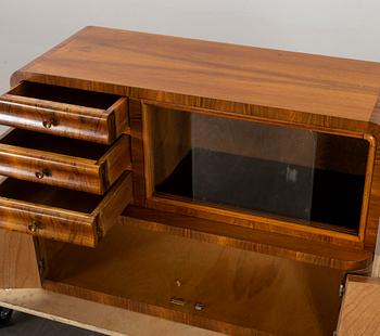 An Art Deco sidetable/cupboard.