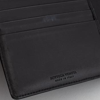 Bottega veneta, a black leather wallet.