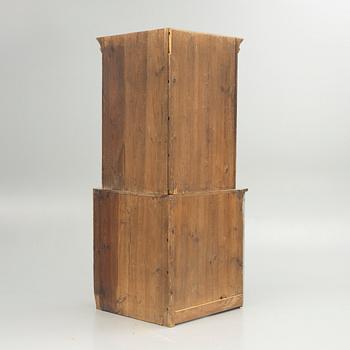 A 19th century corner cabinet.