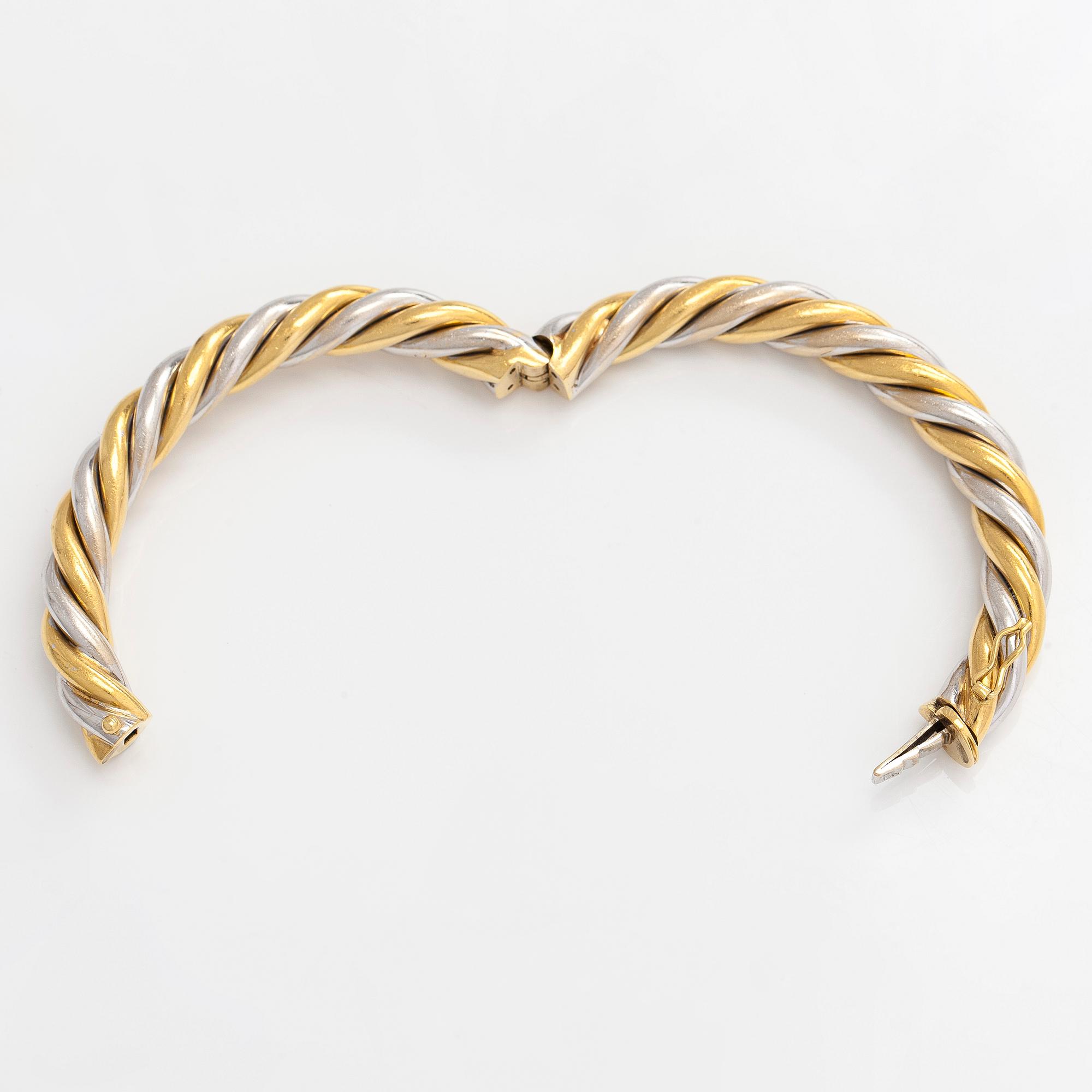 An 18K gold/white gold bracelet, Switzerland.