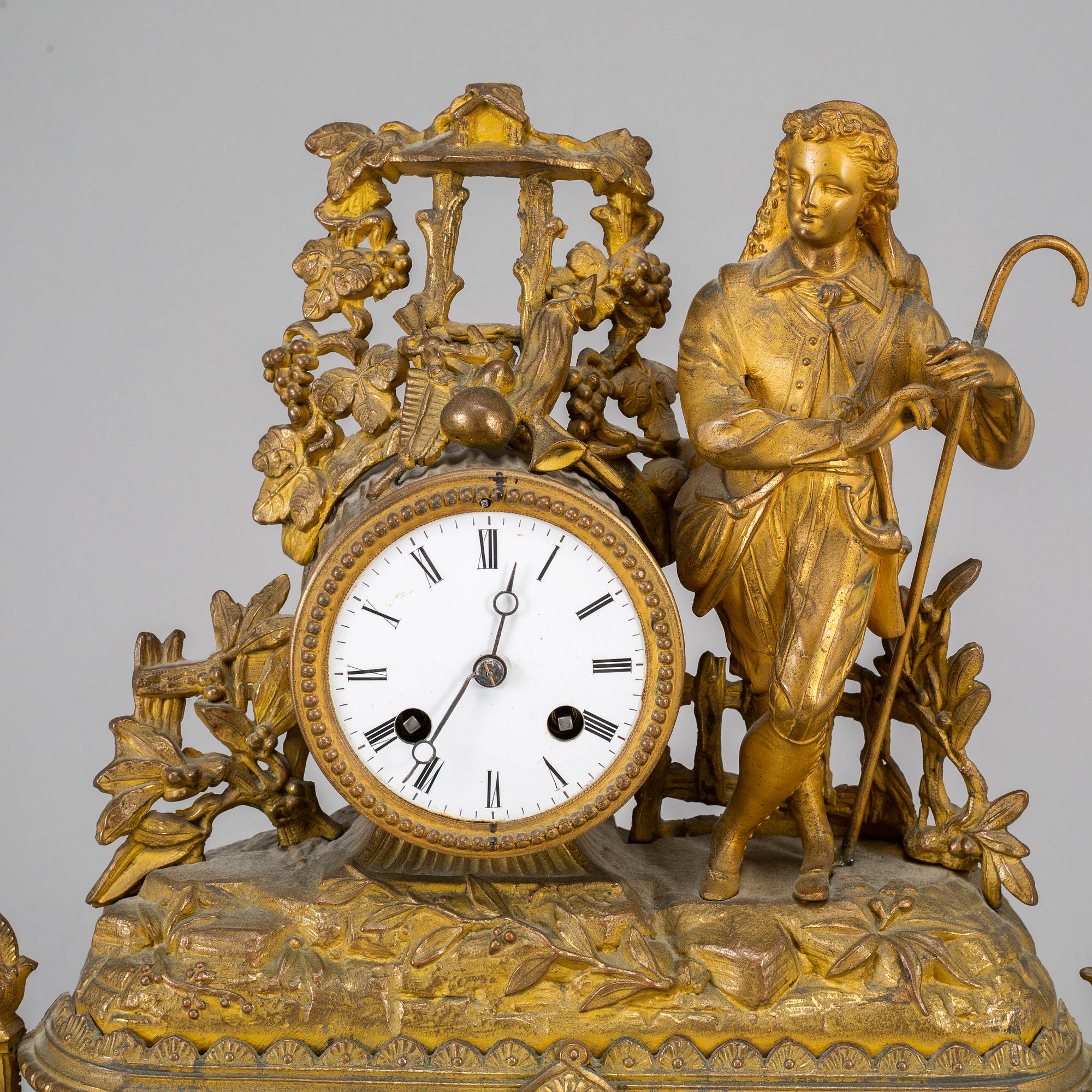 A  19th/20th century mantle clock in Louis-XVI style.