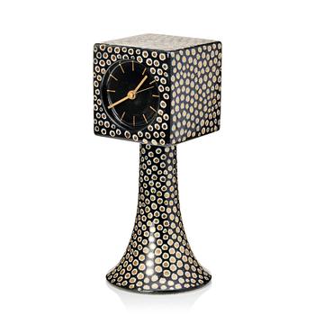 Birger Kaipiainen, a stoneware table clock, Arabia, Finland. Decorated with dots in white and gold against a dark blue/...