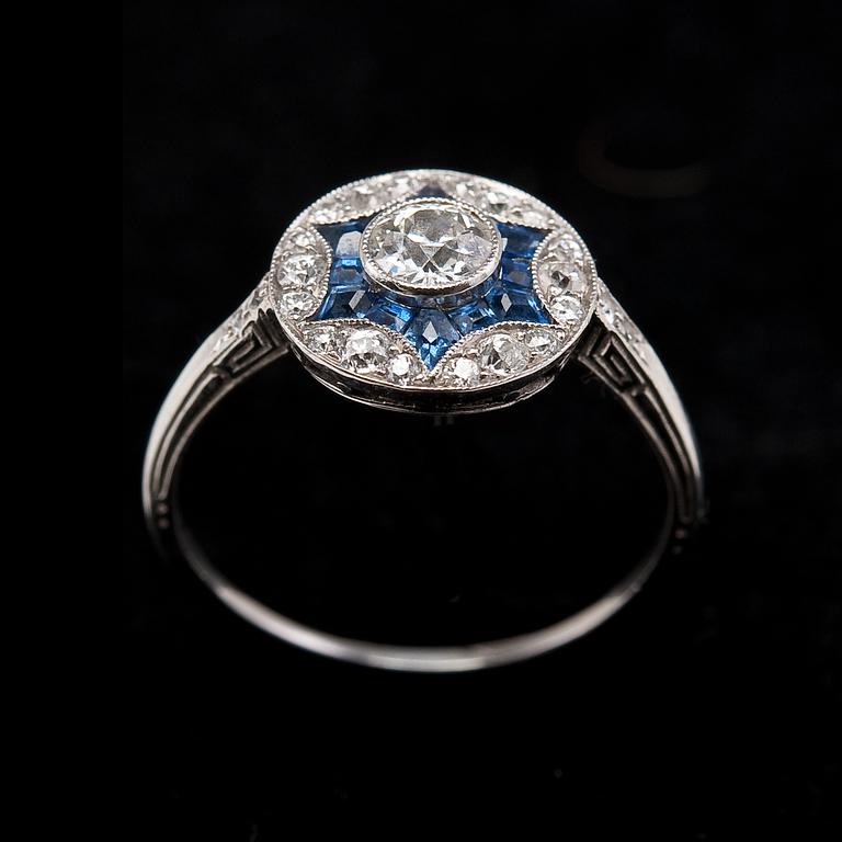 RING, 23 brilliant cut diamonds c. 0.67 ct. 12 fancy cut sapphires.