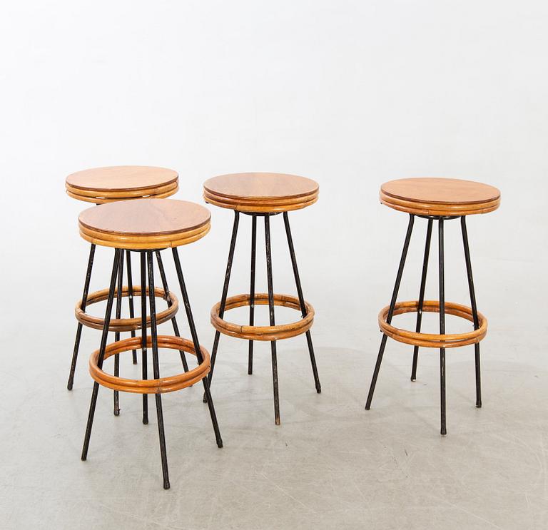 A set of four mid 20th century bar stools.
